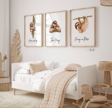 Sloth wall art set featuring 3 adorable sloth prints with inspirational quotes, perfect for a child’s bedroom or sloth-themed room. These playful and calming designs showcase hanging sloths in charming poses, adding a whimsical and relaxing vibe to nursery or kids' room decor. Ideal for sloth lovers, this wall art brings a sense of peace and fun, making it a sweet and cozy addition to any child’s space.








